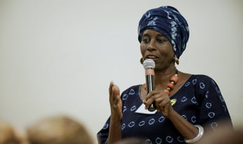 a person walking towards a bus in the city