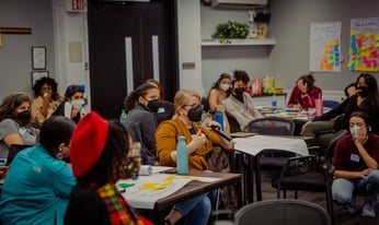 people sitting in a meeting