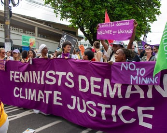 Feminists demanding climate justice at the People's March at COP30. Photo by Ariana Rodriguez-Gitler