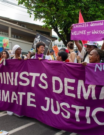 Feminists demanding climate justice at the People's March at COP30. Photo by Ariana Rodriguez-Gitler