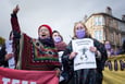 COP26 woman with raised hand